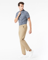 Side view of model wearing New British Khaki Workday Khaki Pants, Slim Fit.