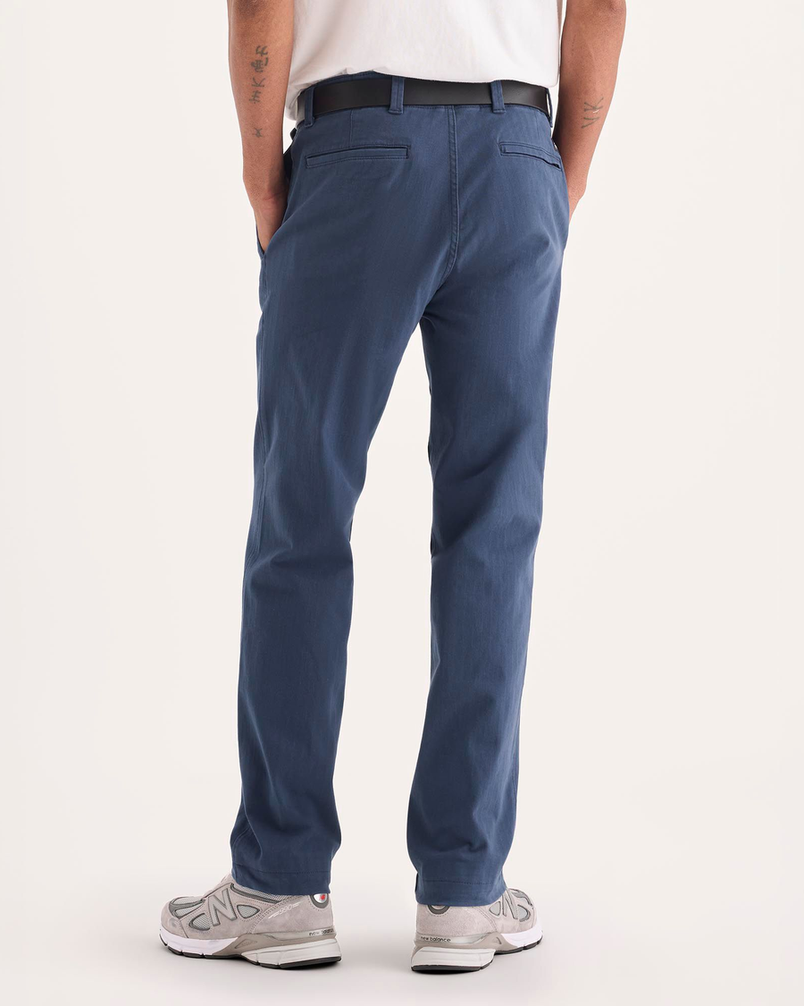 Back view of model wearing Ocean Blue Alpha Chino Pants, Slim Fit.