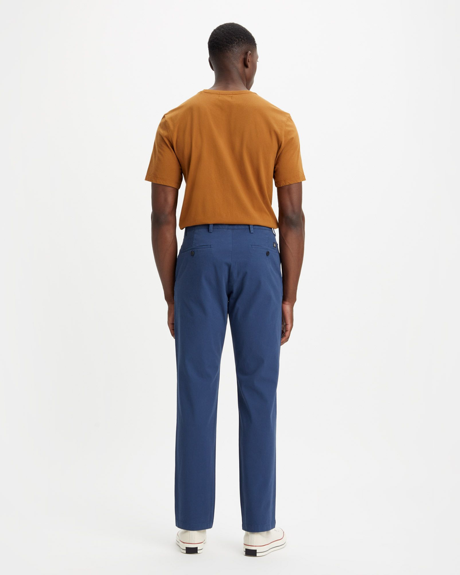 Back view of model wearing Ocean Blue Crafted Khaki Pants, Slim Fit.