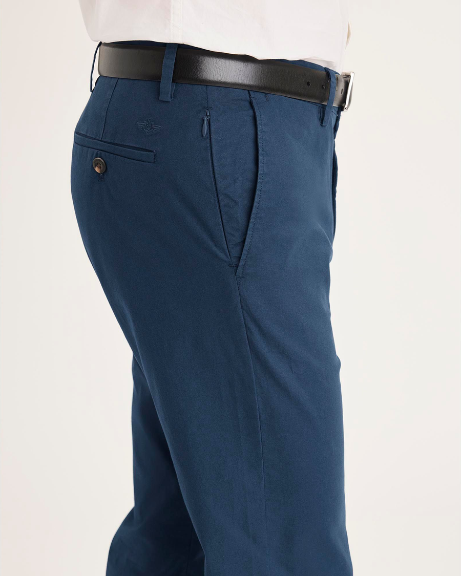 Side view of model wearing Ocean Blue Crafted Khaki Pants, Slim Fit.