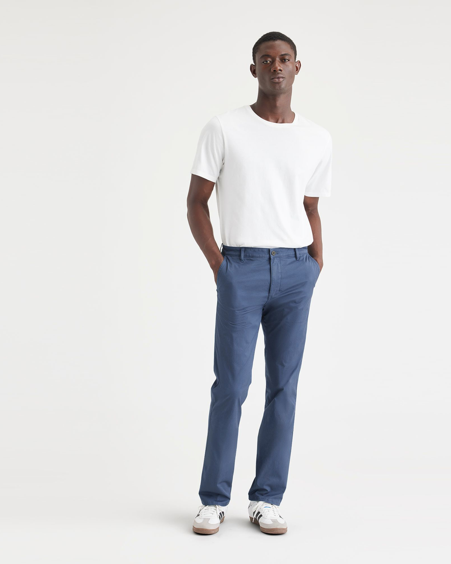 Front view of model wearing Ocean Blue Men's Slim Fit Original Chino Pants.