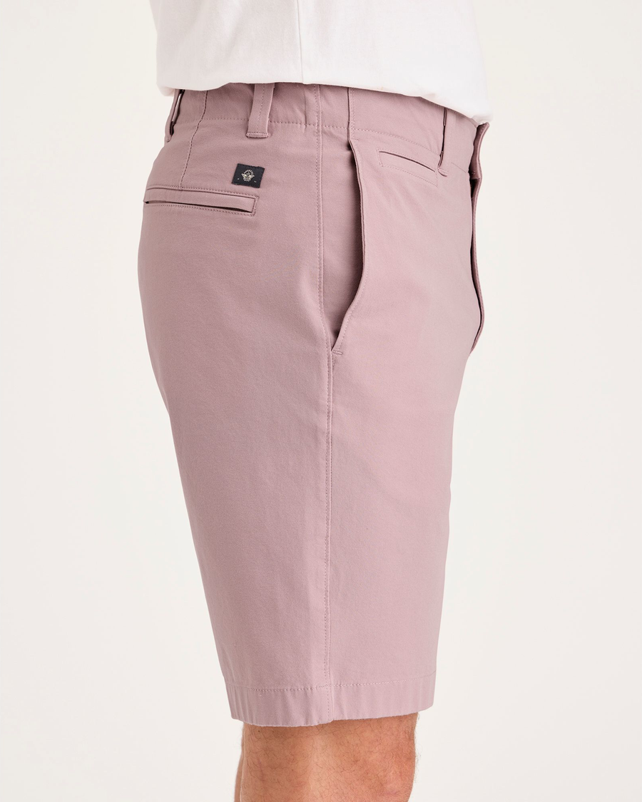 Side view of model wearing Pale Mauve Alpha Chino Shorts, Straight Fit.