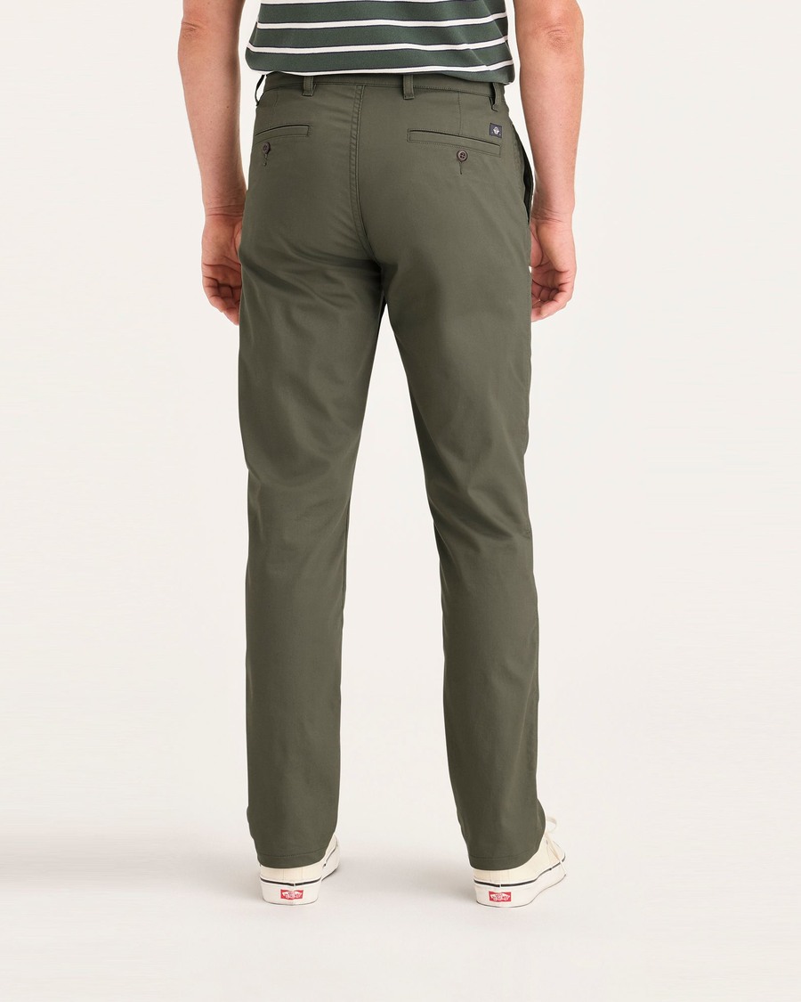 Back view of model wearing Parkfied Buttercream Crown Blue Men's Slim Fit Smart 360 Flex Ultimate Chino Pants.