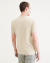 Back view of model wearing Pastime Buttercream Seedling Men's Slim Fit Logo Tee.