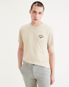 Front view of model wearing Pastime Buttercream Seedling Men's Slim Fit Logo Tee.