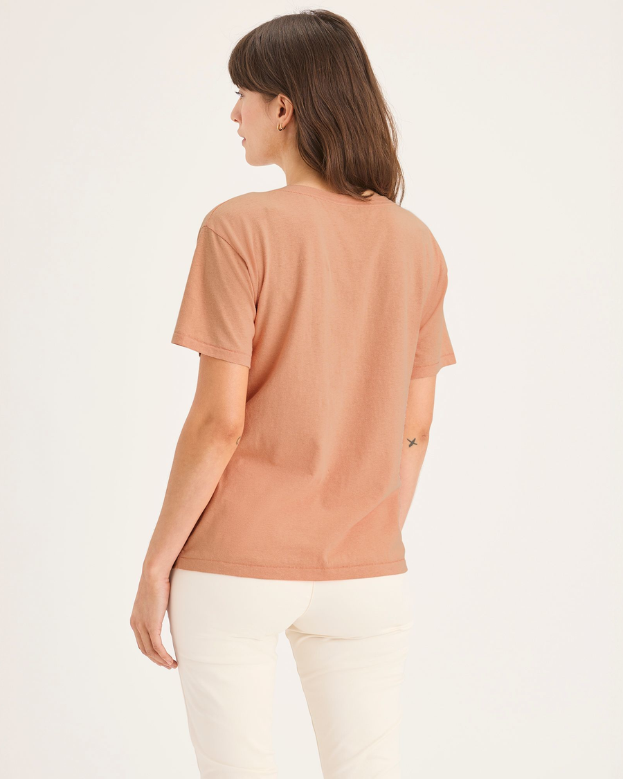 Back view of model wearing Peach Bloom Women's Deep V-Neck Tee Shirt.
