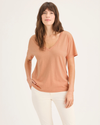Front view of model wearing Peach Bloom Women's Deep V-Neck Tee Shirt.
