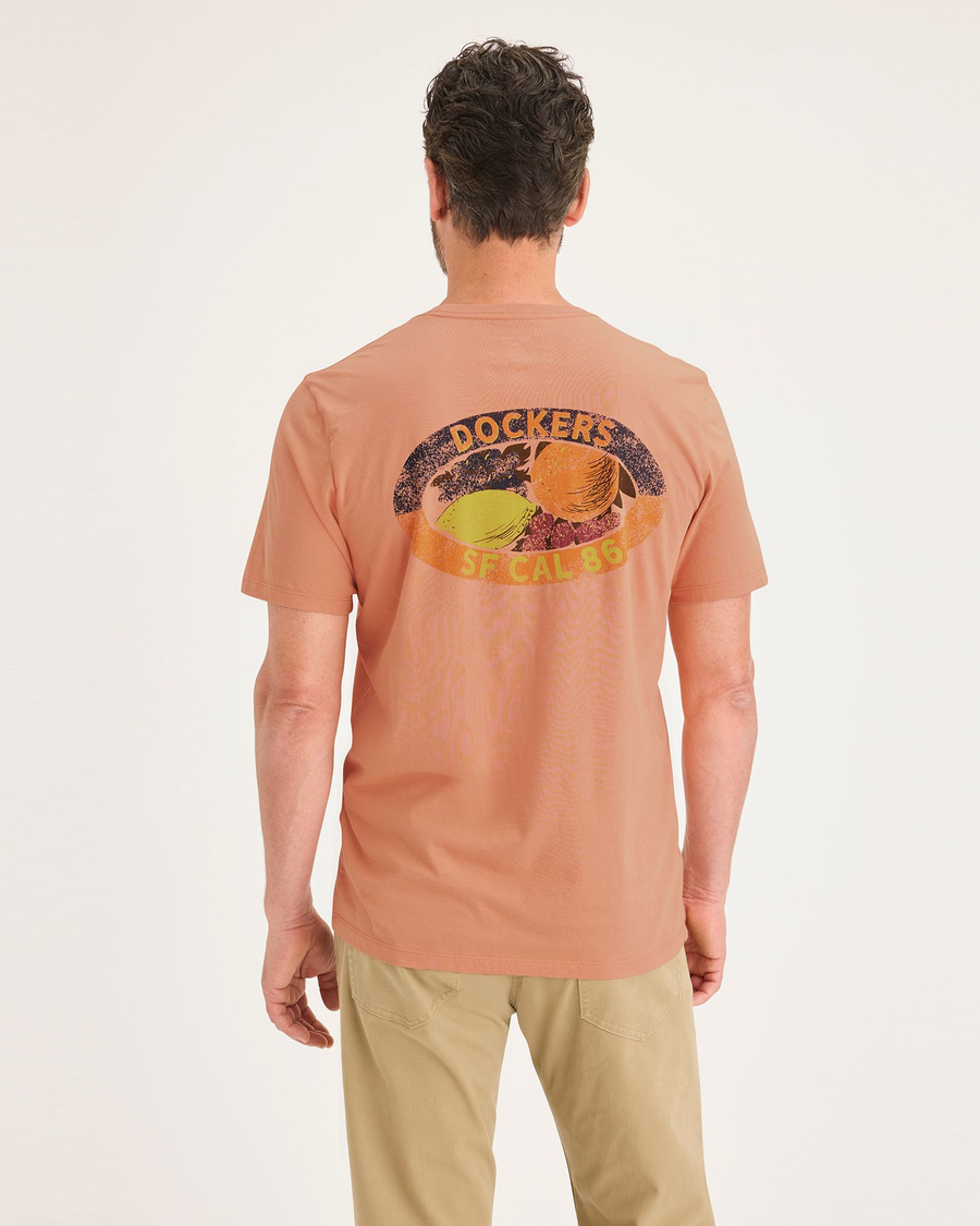 Back view of model wearing Peach Blossom Men's Slim Fit Logo Tee.