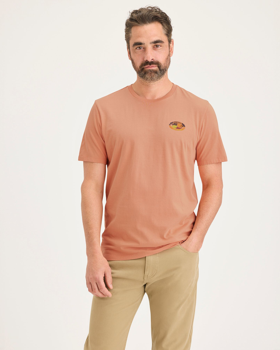 Front view of model wearing Peach Blossom Men's Slim Fit Logo Tee.