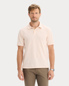 Front view of model wearing Peach Blush Pique Polo, Slim Fit.