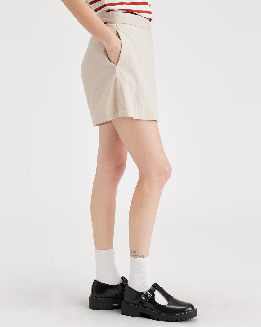 Side view of model wearing Sahara Khaki Women's Mini Skirt.