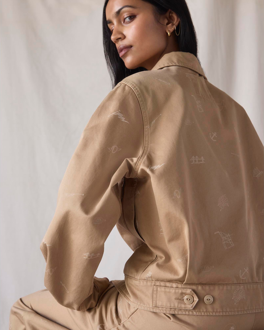 Back view of model wearing Seaworthy Khaki Dockers® x Transnomadica Mechanics Jacket.