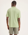 Back view of model wearing Seedling Men's Slim Fit Pique Polo.