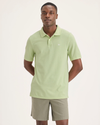 Front view of model wearing Seedling Men's Slim Fit Pique Polo.