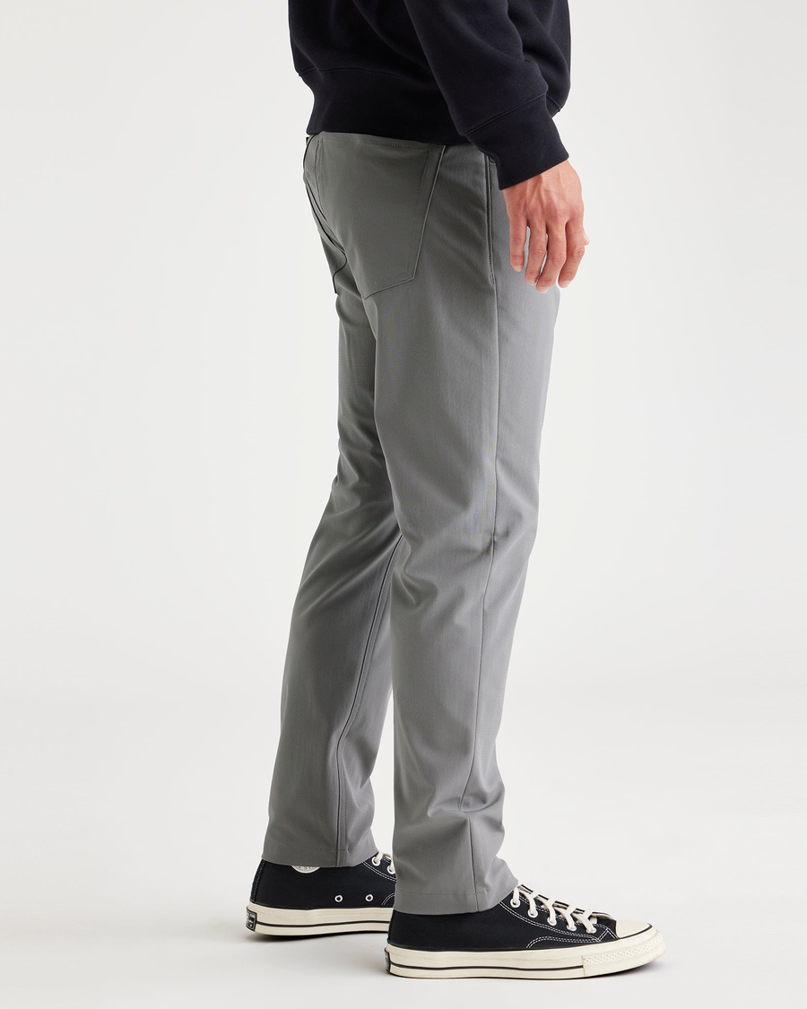 Side view of model wearing Sharkskin Jean Cut Go, Slim Tapered Fit with Airweave.