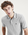 View of model wearing Smokestack Heather Men's Slim Fit Original Polo.