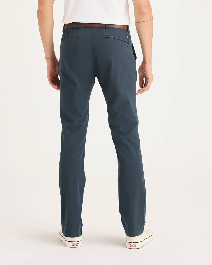 Back view of model wearing Stratified Sea Men's Skinny Fit Smart 360 Flex California Chino Pants.