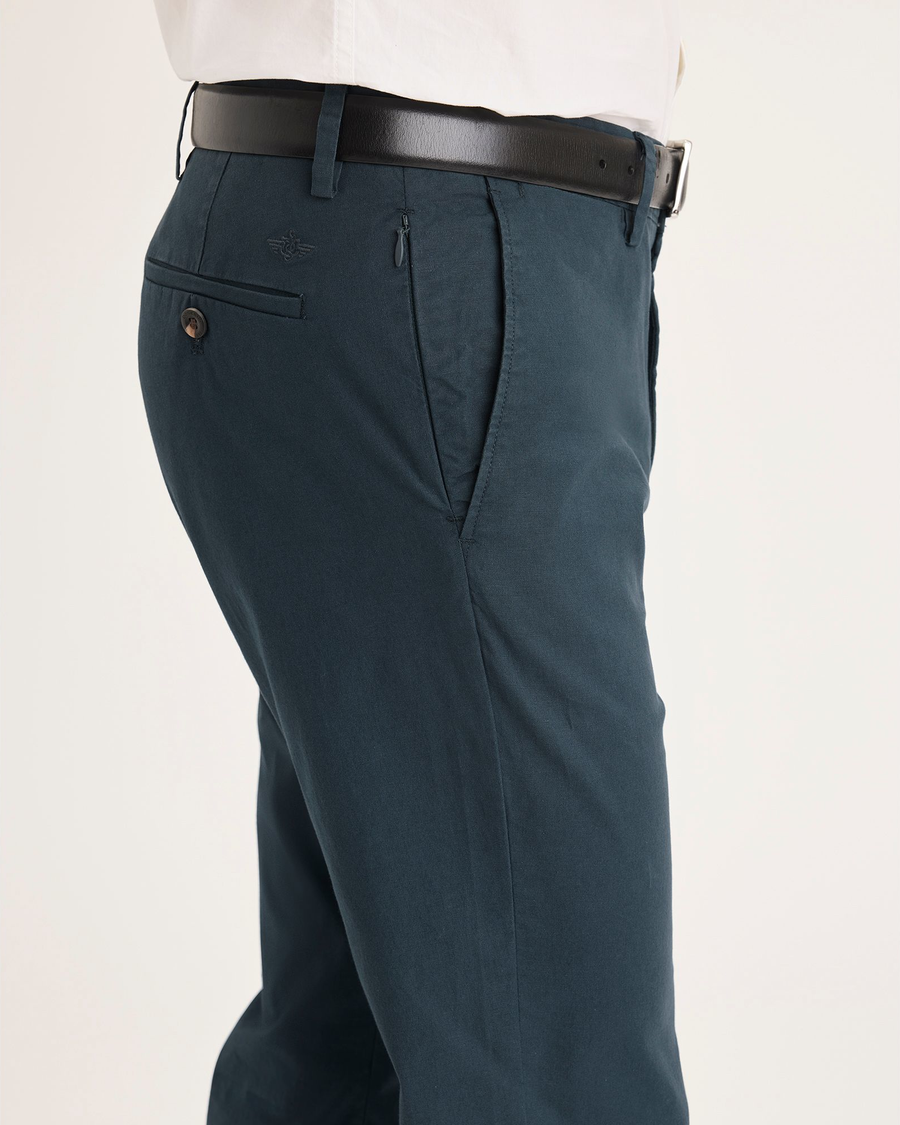 Side view of model wearing Stratified Sea Men's Slim Fit Smart 360 Flex Alpha Chino Pants.