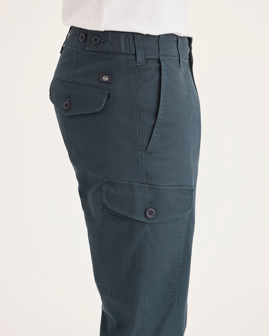 Side view of model wearing Stratified Sea Men's Slim Tapered Fit Cargo Pants.