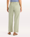 Back view of model wearing Tea Blake Chino Pants, High Straight Fit.