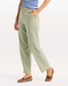 Side view of model wearing Tea Blake Chino Pants, High Straight Fit.