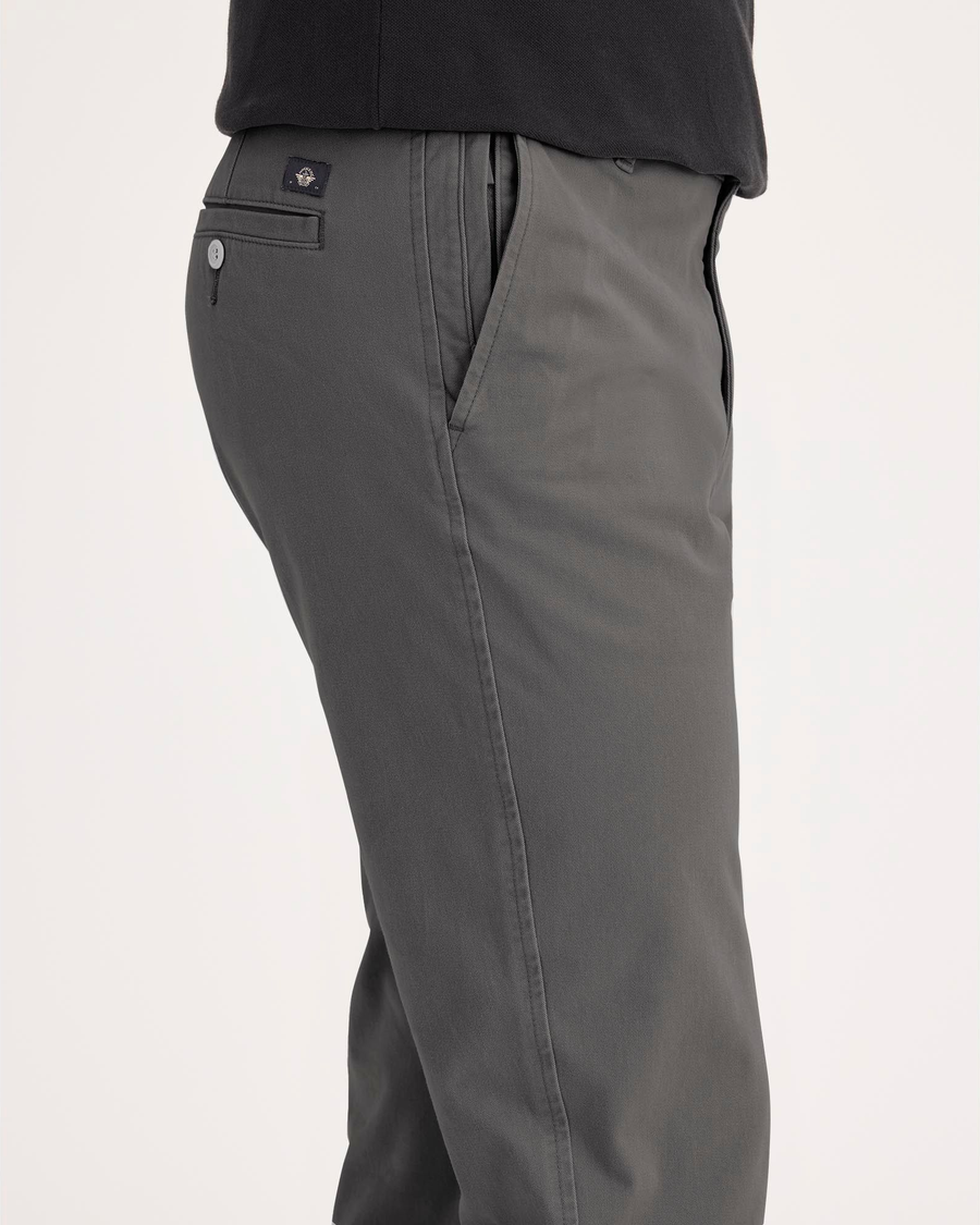 Side view of model wearing Thunderstorm Ultimate Chinos, Slim Fit.