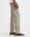 Side view of model wearing Timber Wolf Original Chino, Slim Fit.