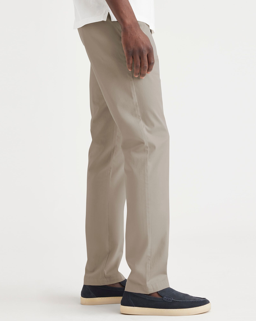 Side view of model wearing Timber Wolf Original Chino, Slim Fit.