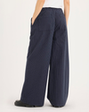 Back view of model wearing Total Eclipse Drawsting Pant, Regular Fit.