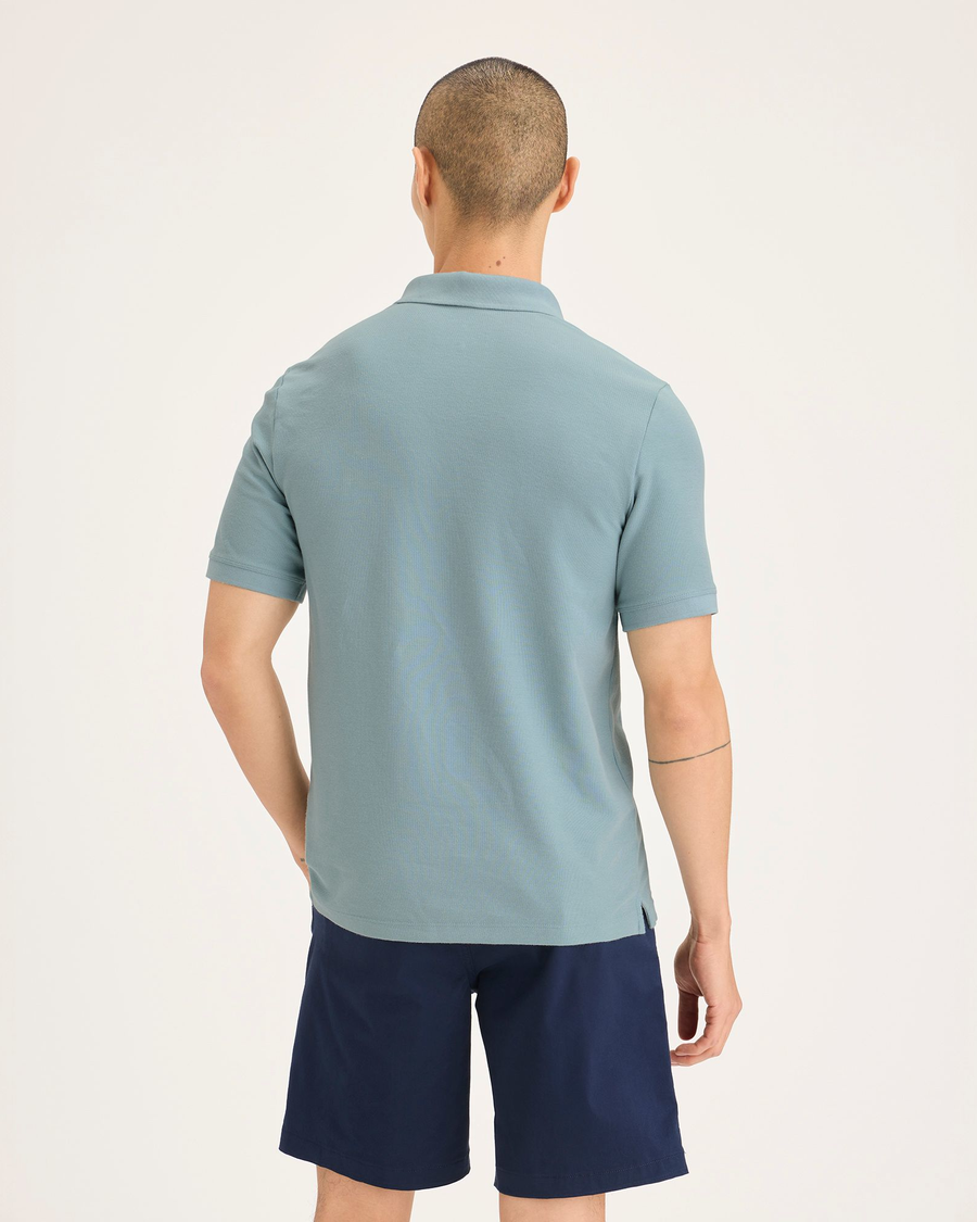 Back view of model wearing Tourmaline Men's Slim Fit Original Polo Shirt.