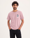 Front view of model wearing Varsity Emblem Graphic Tee, Slim Fit.