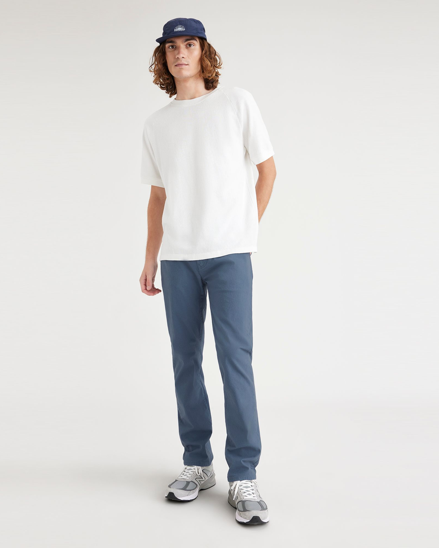 View of model wearing Vintage Indigo Men's Slim Fit Smart 360 Flex Jean Cut Pants.