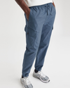 View of model wearing Vintage Indigo Men's Straight Tapered Fit Cargo Jogger Pants.