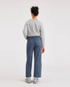 Back view of model wearing Vintage Indigo Women's Straight Fit High Jean Cut Pants.