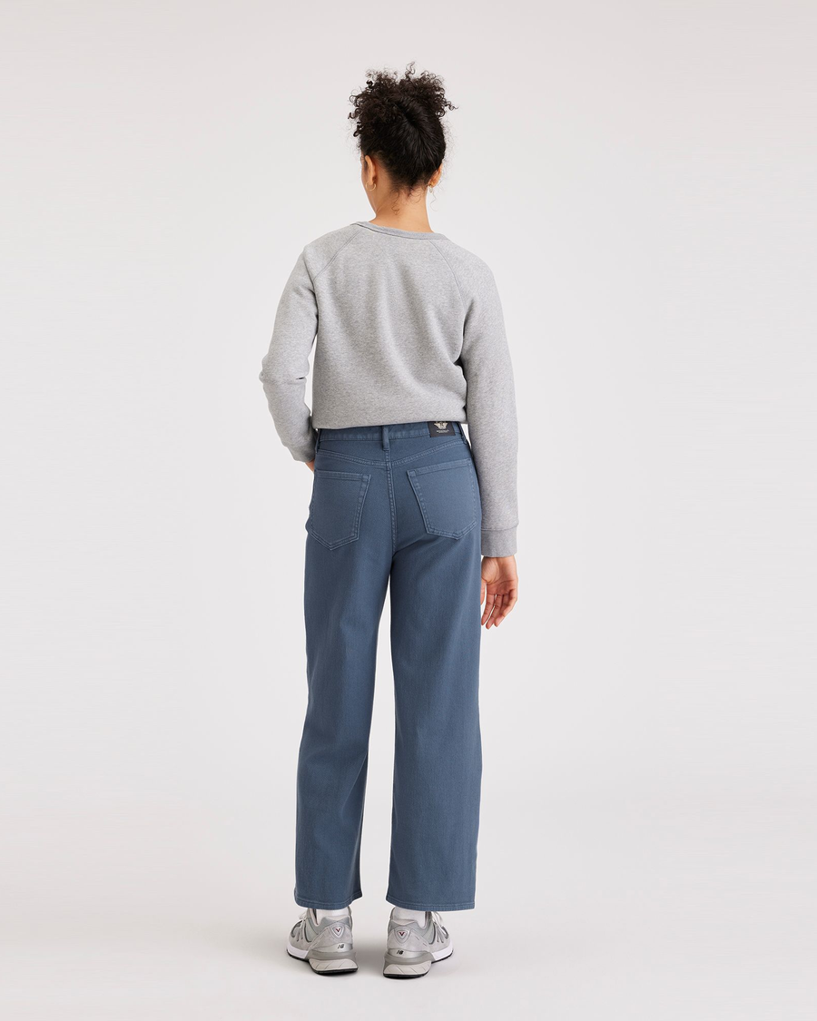 Back view of model wearing Vintage Indigo Women's Straight Fit High Jean Cut Pants.