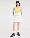 View of model wearing White Garment Dye Women's Button Front Mini Skirt.